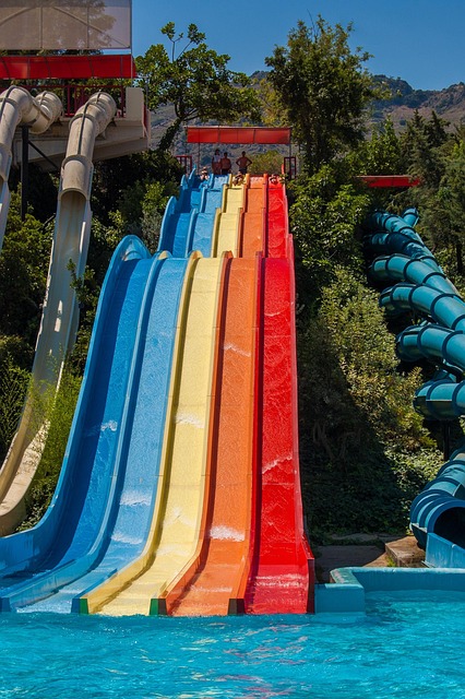 Beach-Themed Water Slides with Inflatable Volcanoes for Dramatic Fun